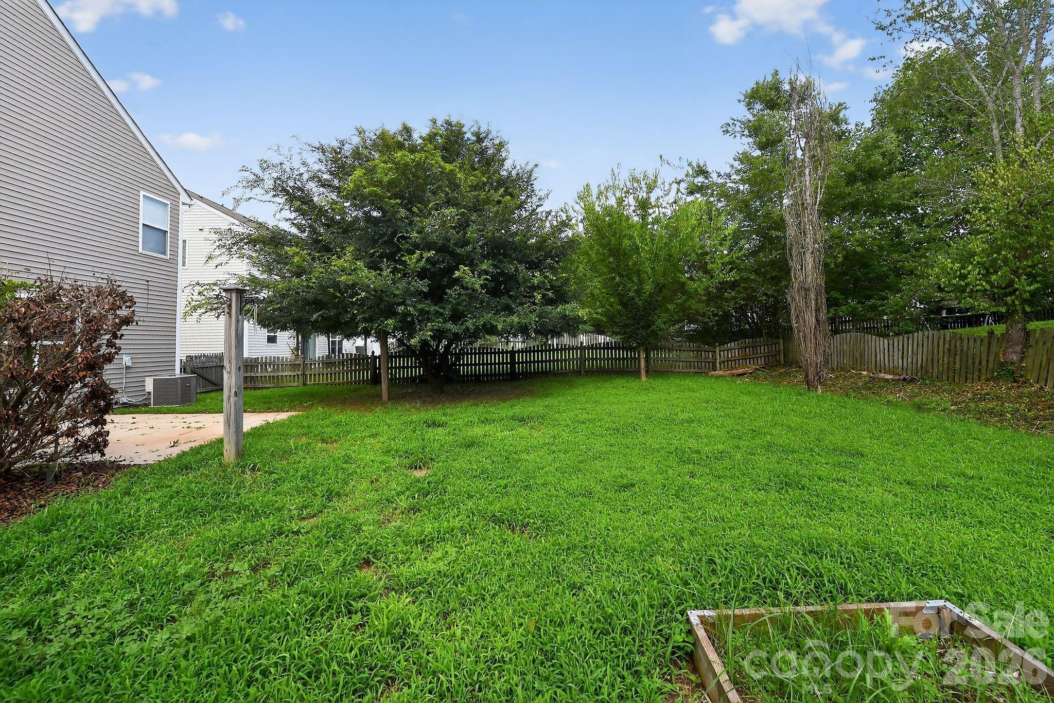 3114 Less Traveled Trail Indian Trail, NC 28079 - Photo 11 of 37 a view of a yard with grass