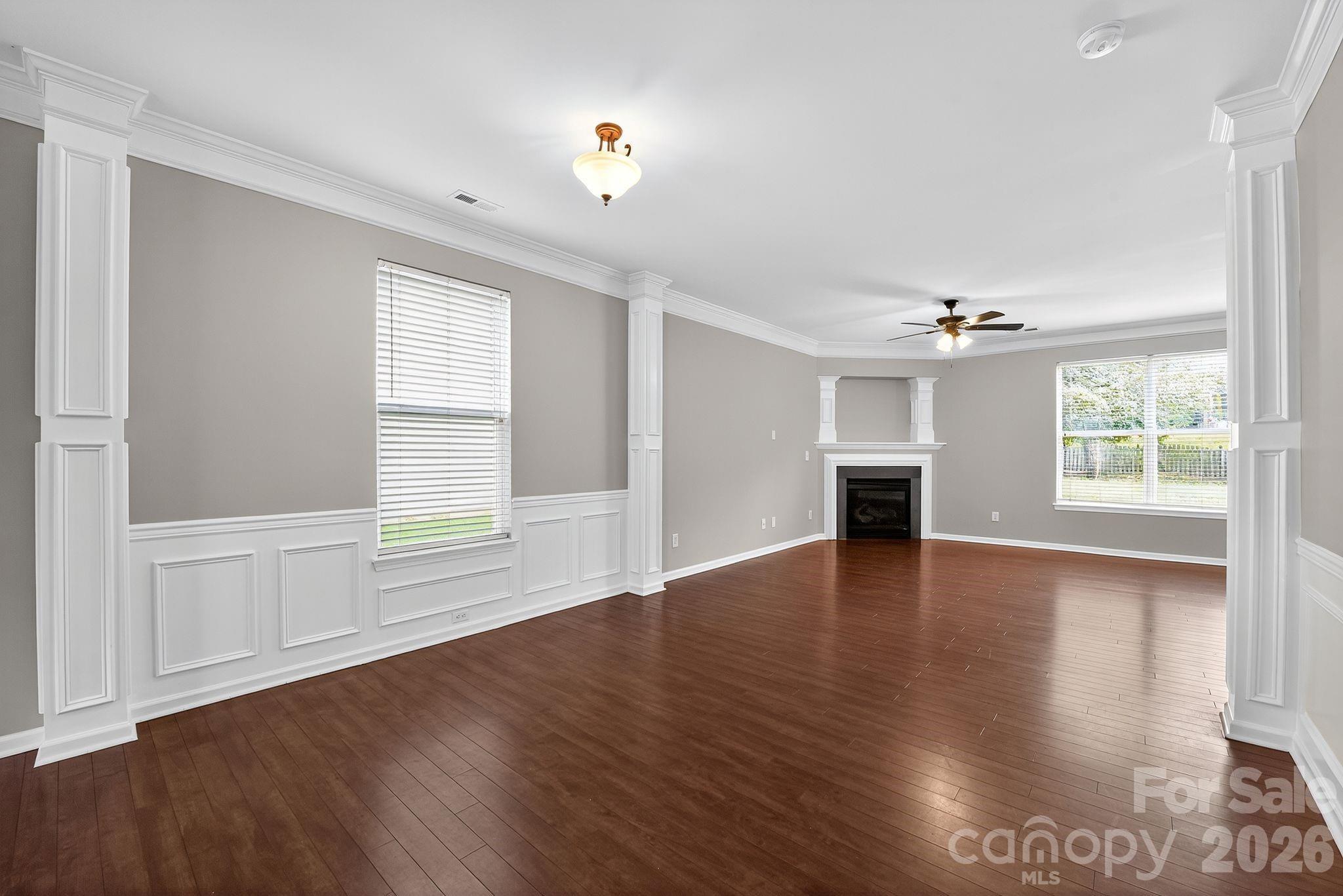 3114 Less Traveled Trail Indian Trail, NC 28079 - Photo 18 of 37 an empty room with wooden floor and windows