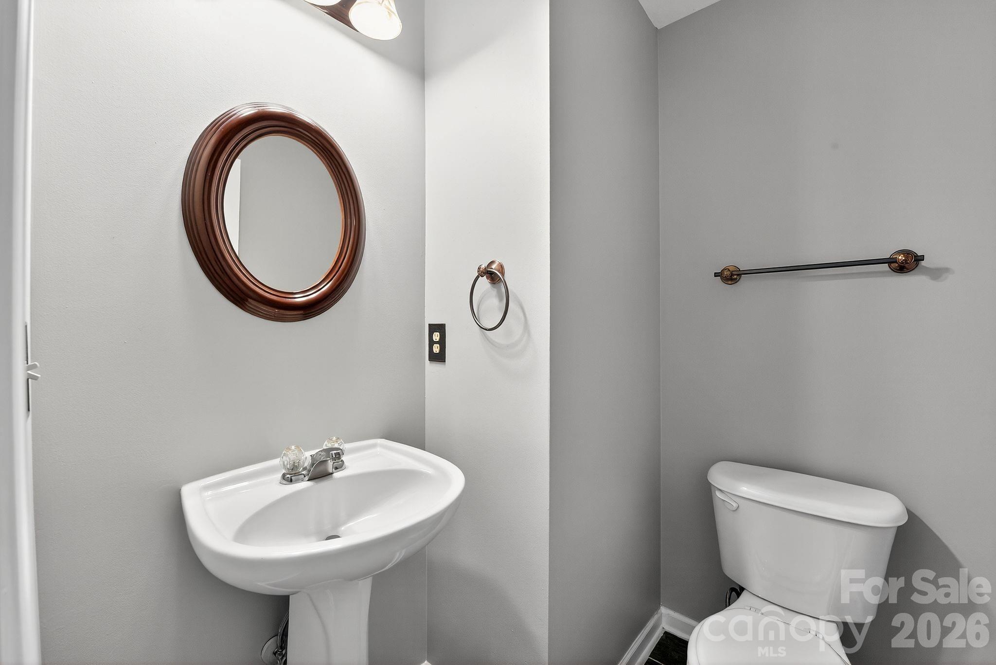3114 Less Traveled Trail Indian Trail, NC 28079 - Photo 25 of 37 a bathroom with a toilet sink and mirror