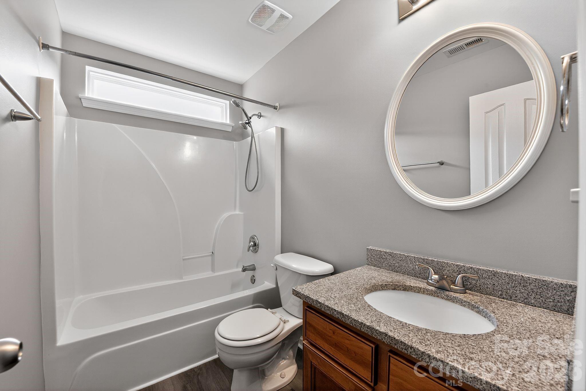 3114 Less Traveled Trail Indian Trail, NC 28079 - Photo 32 of 37 a bathroom with a granite countertop sink toilet and shower