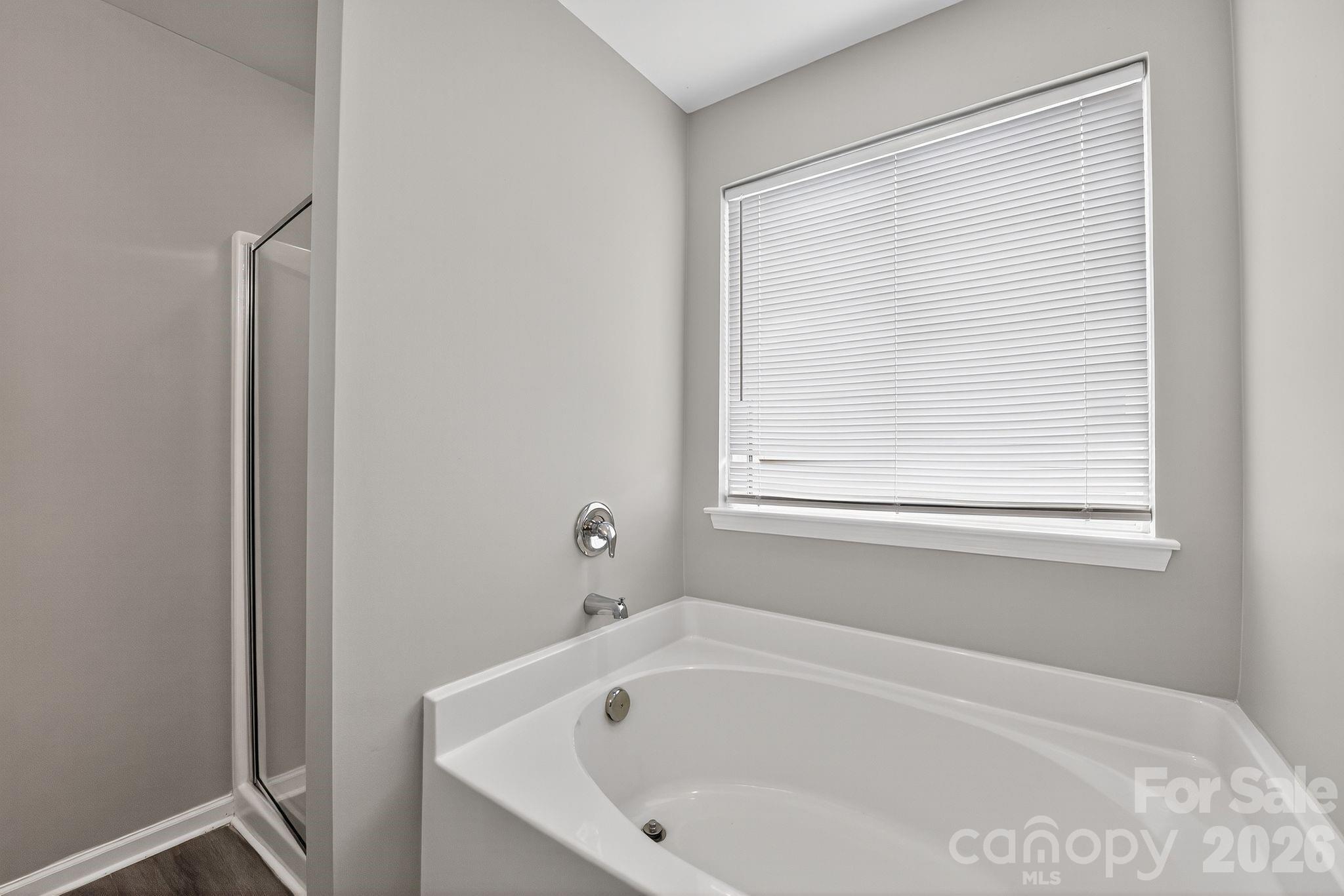 3114 Less Traveled Trail Indian Trail, NC 28079 - Photo 35 of 37 a white bath tub sitting next to a window