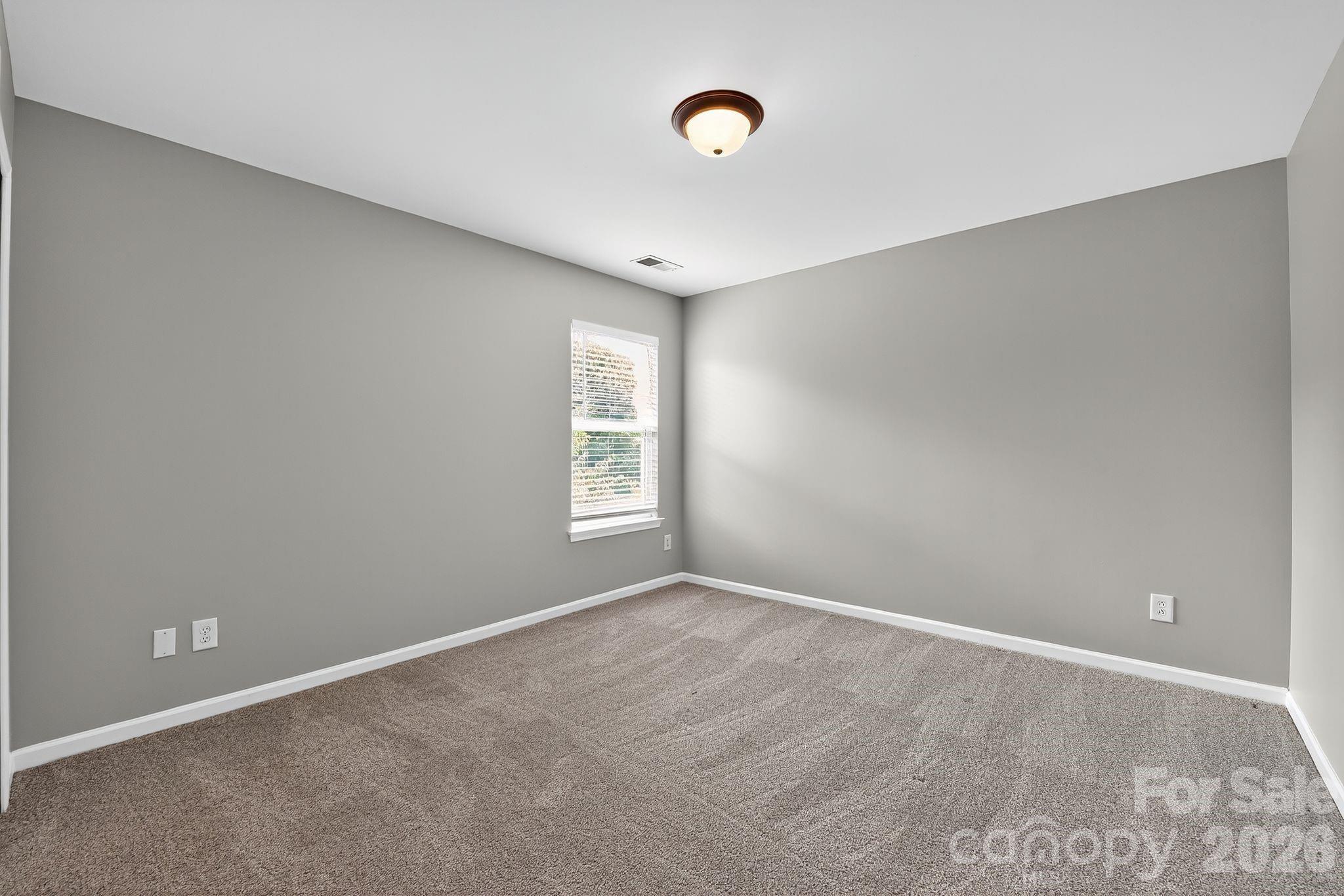 3114 Less Traveled Trail Indian Trail, NC 28079 - Photo 36 of 37 a view of an empty room with a window