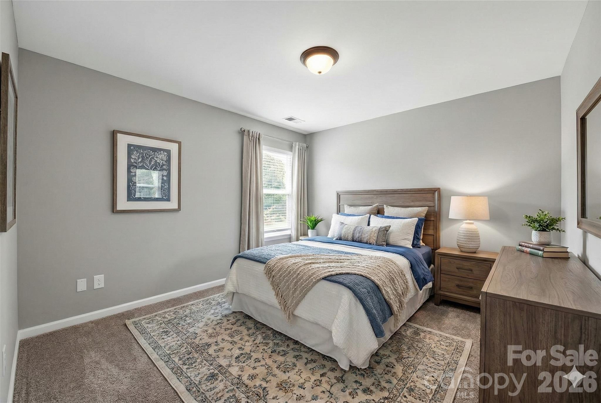3114 Less Traveled Trail Indian Trail, NC 28079 - Photo 5 of 37 a bedroom with a bed and wooden floor