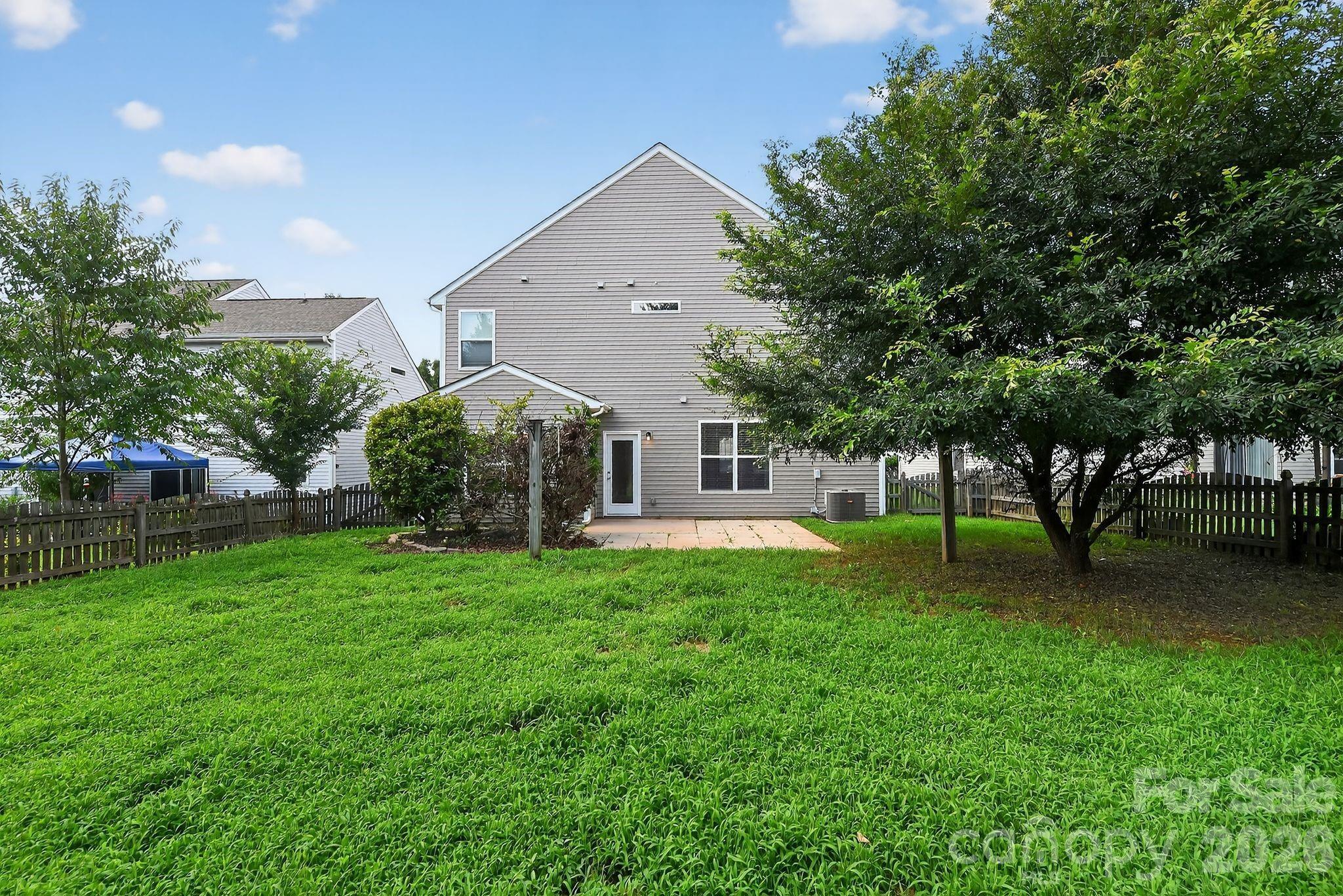 3114 Less Traveled Trail Indian Trail, NC 28079 - Photo 9 of 37 a view of a house with a backyard