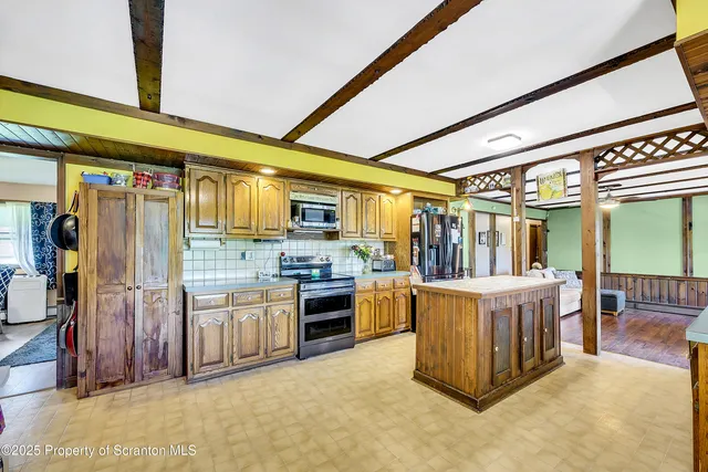 a bedroom with bed and a window