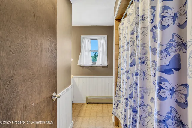 walk in closet with clothes and shoes