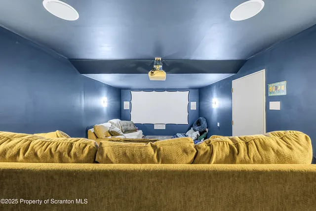 a utility room with dryer and racks