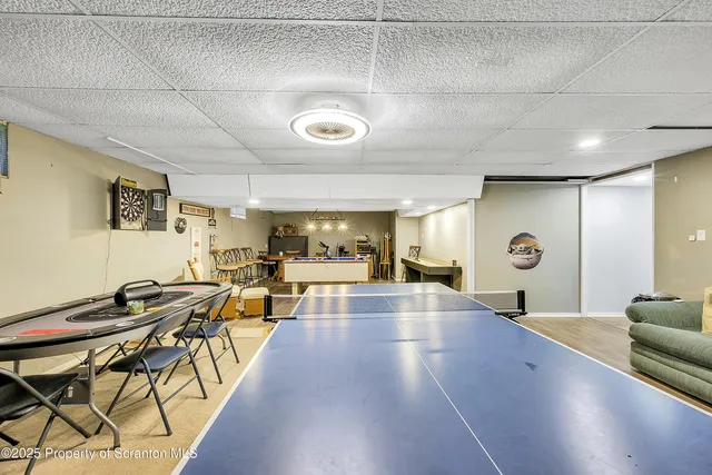 a room with furniture and a flat screen tv