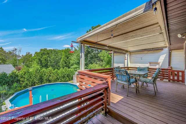 a view of a chairs and table in the patio
