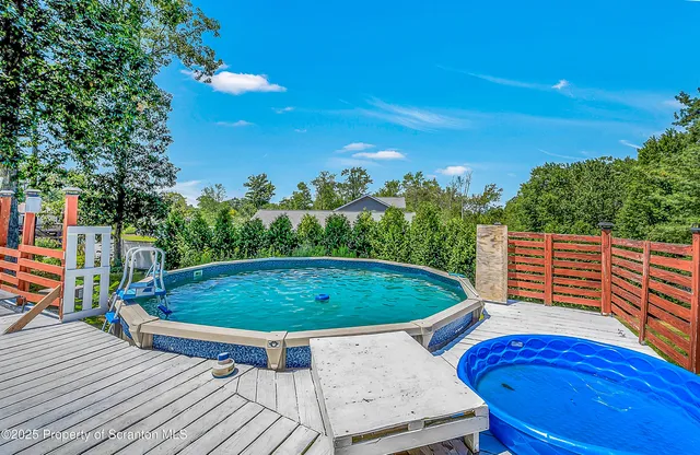 a view of a swimming pool with a patio