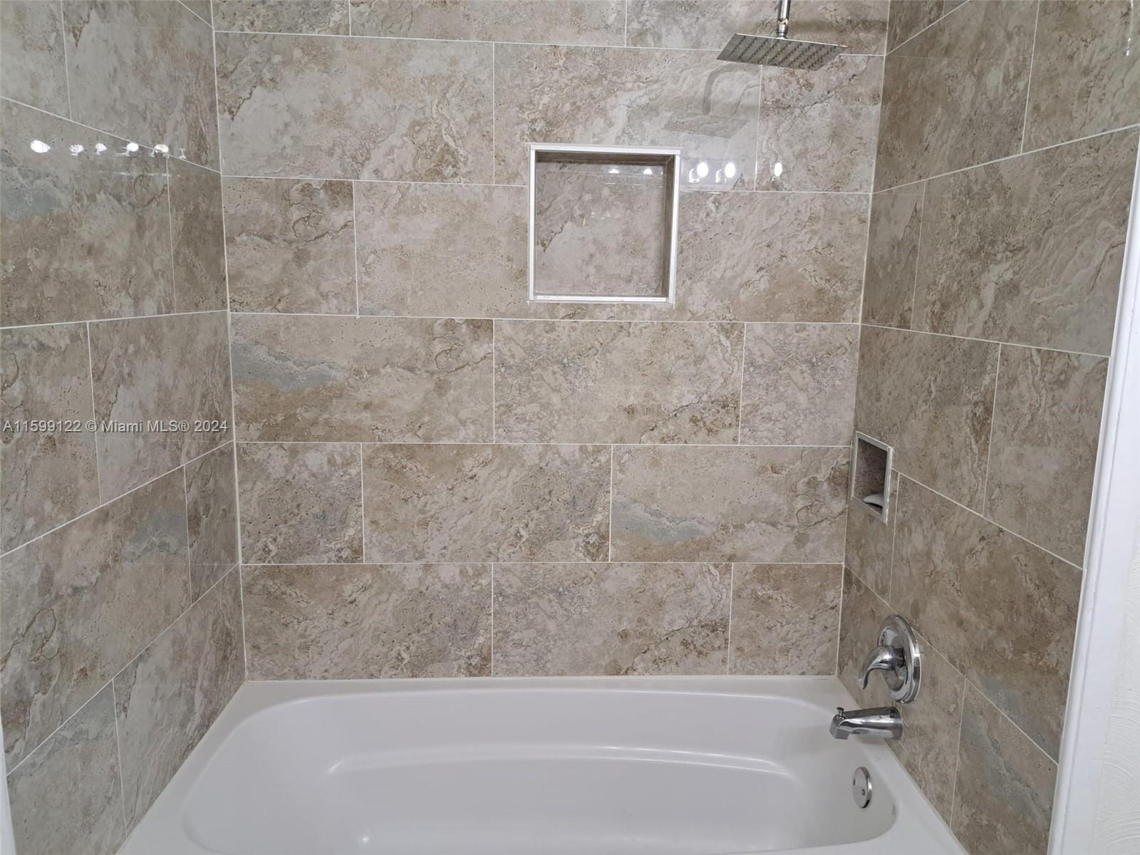 Jacaranda Plantation, FL 33324 - Photo 14 of 23 a bathroom with a bathtub