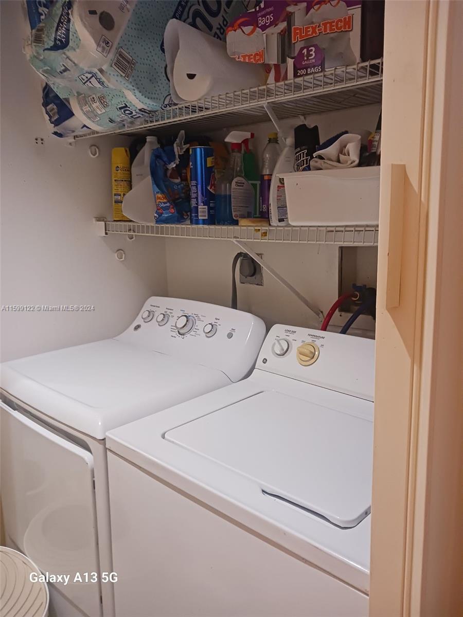 Jacaranda Plantation, FL 33324 - Photo 19 of 23 a utility room with dryer and washer