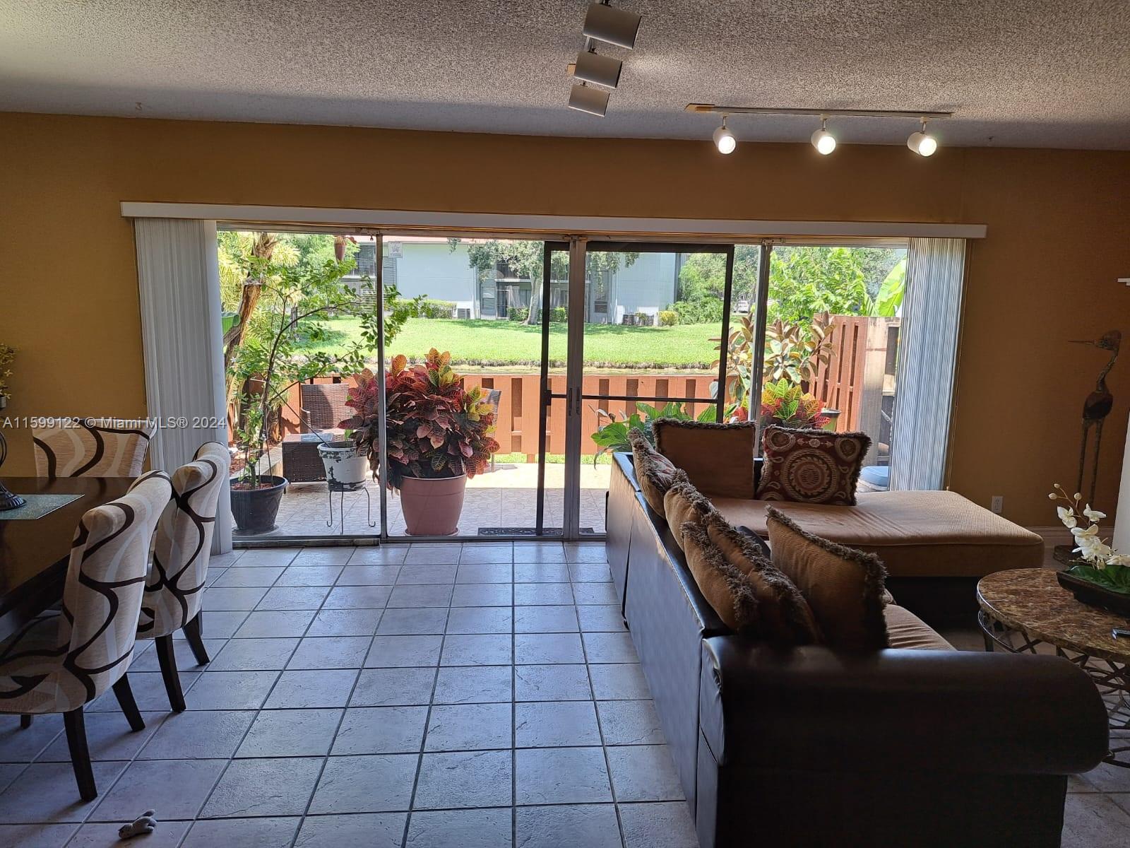 Jacaranda Plantation, FL 33324 - Photo 4 of 23 a living room with furniture and a large window
