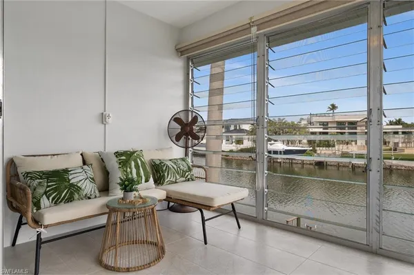 a view of a balcony with chairs