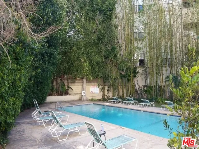 a view of a swimming pool with a patio
