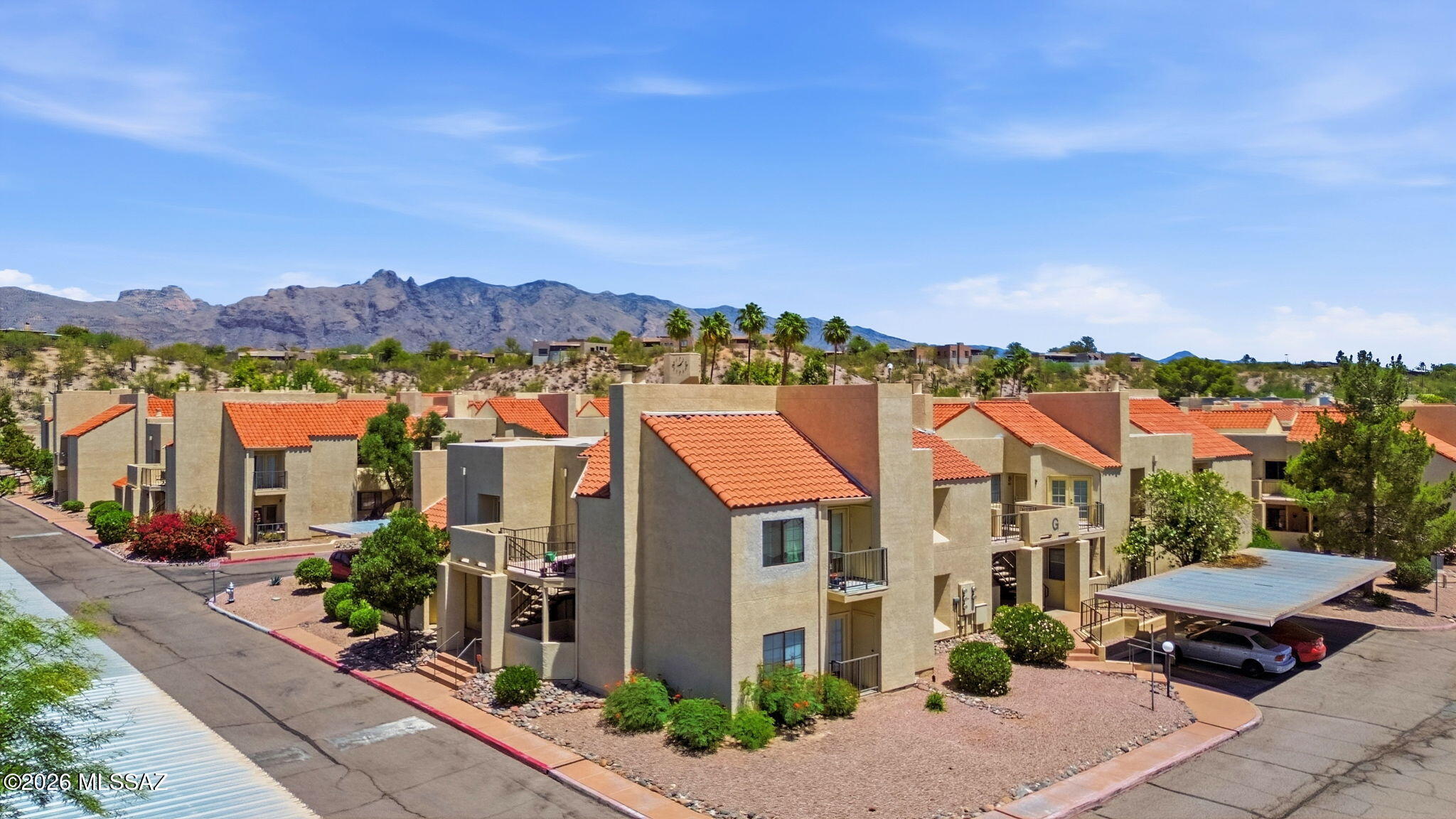 1200 East River Road, Unit G87 Tucson, AZ 85718 - Photo 2 of 30 a view of residential houses with a street
