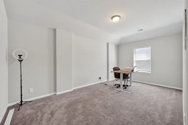 a workspace with furniture and a window