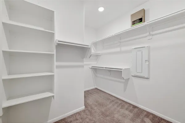 a view of an empty walk in closet