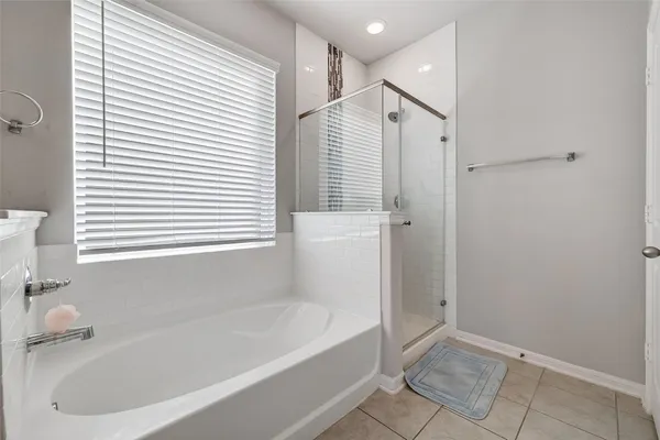 a white bath tub sitting next to a white sink