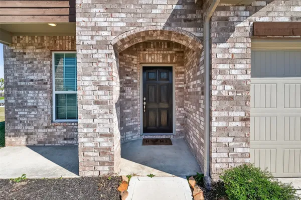 a front view of a house with a glass door