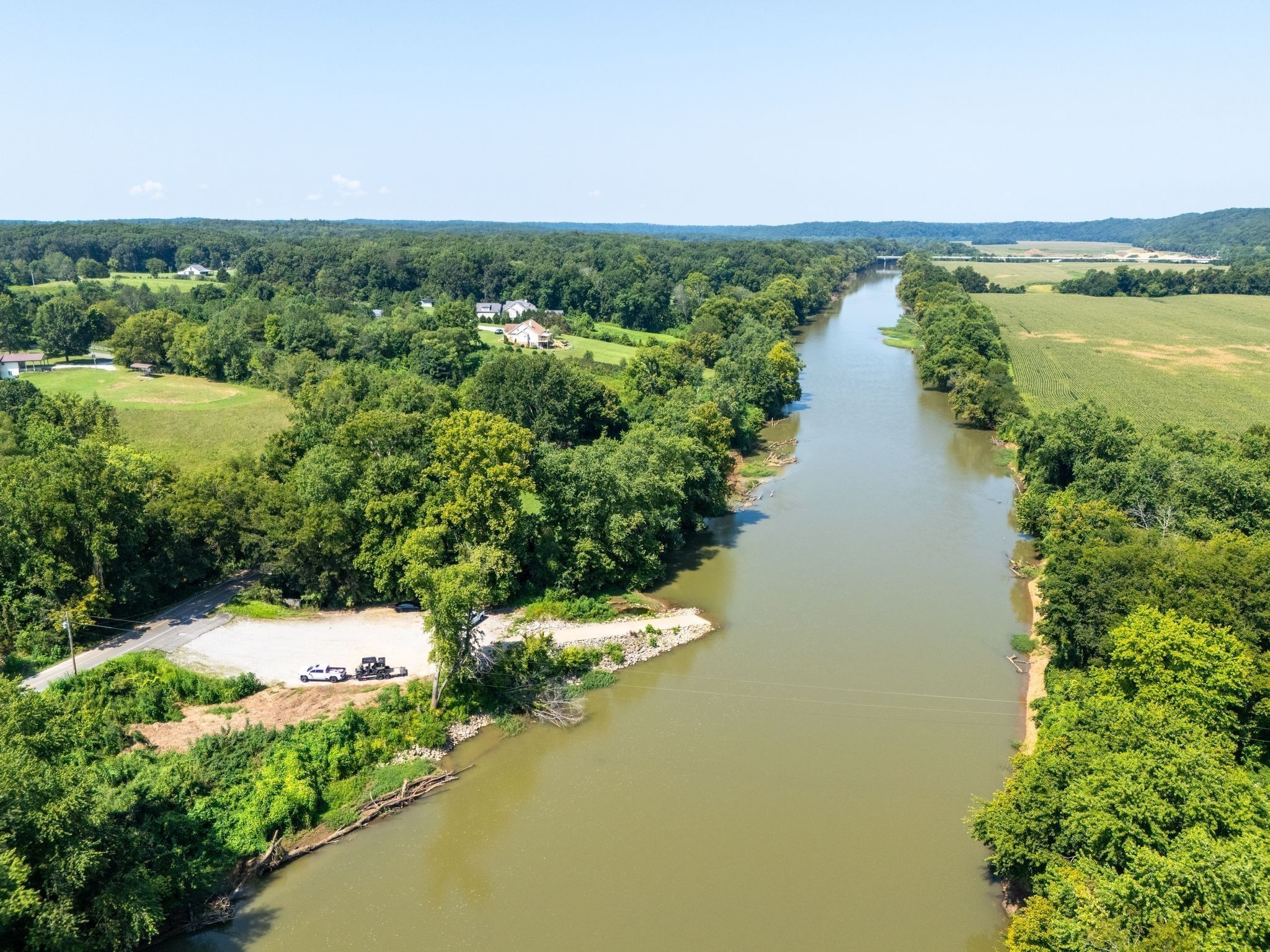 715 Dyer Road Hurricane Mills, TN 37078 - Photo 17 of 36 a view of a lake with a yard