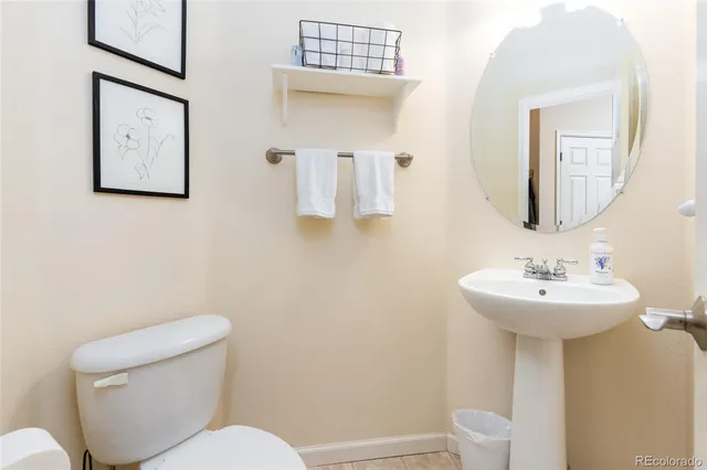 a bedroom with a bed and a table