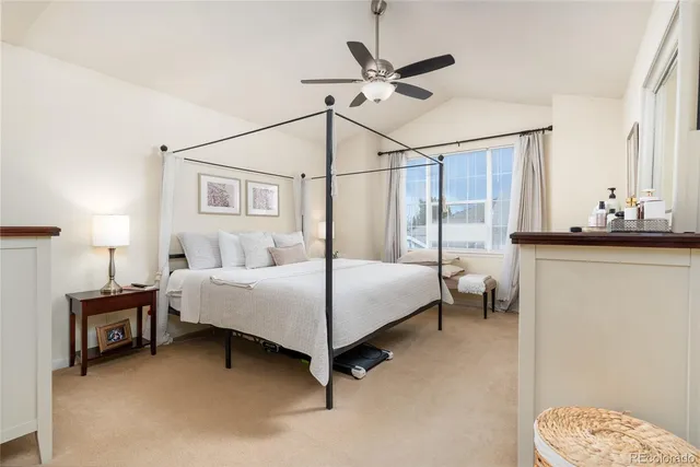 a bathroom with a granite countertop sink a toilet and mirror
