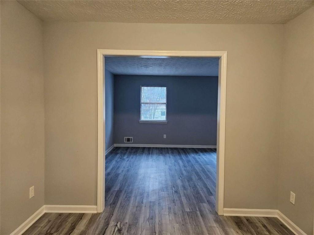 4321 Sebring Walk Decatur, GA 30034 - Photo 11 of 31 a view of a small space with wooden floor and a window