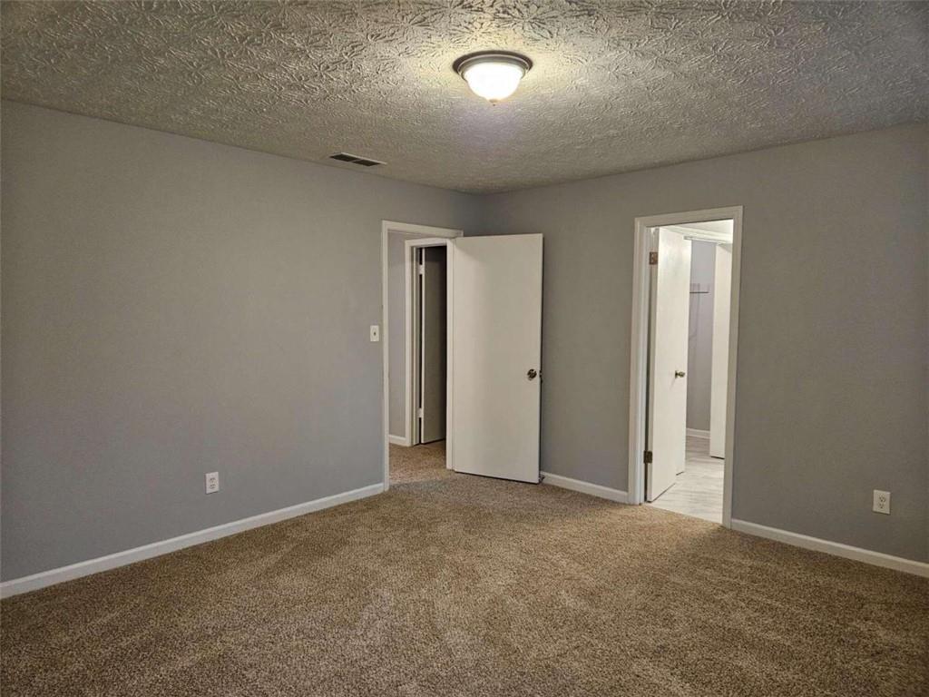 4321 Sebring Walk Decatur, GA 30034 - Photo 20 of 31 an empty room with windows and closet