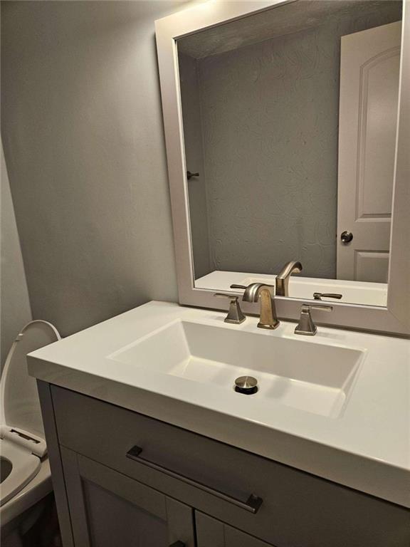 4321 Sebring Walk Decatur, GA 30034 - Photo 24 of 31 a bathroom with a sink and a toilet