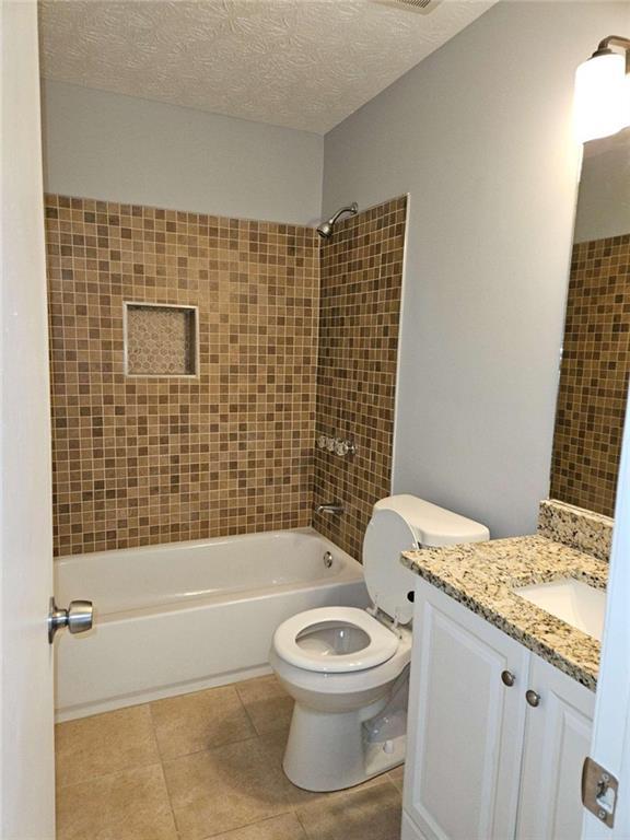 4321 Sebring Walk Decatur, GA 30034 - Photo 27 of 31 a bathroom with a granite countertop toilet a sink and bathtub