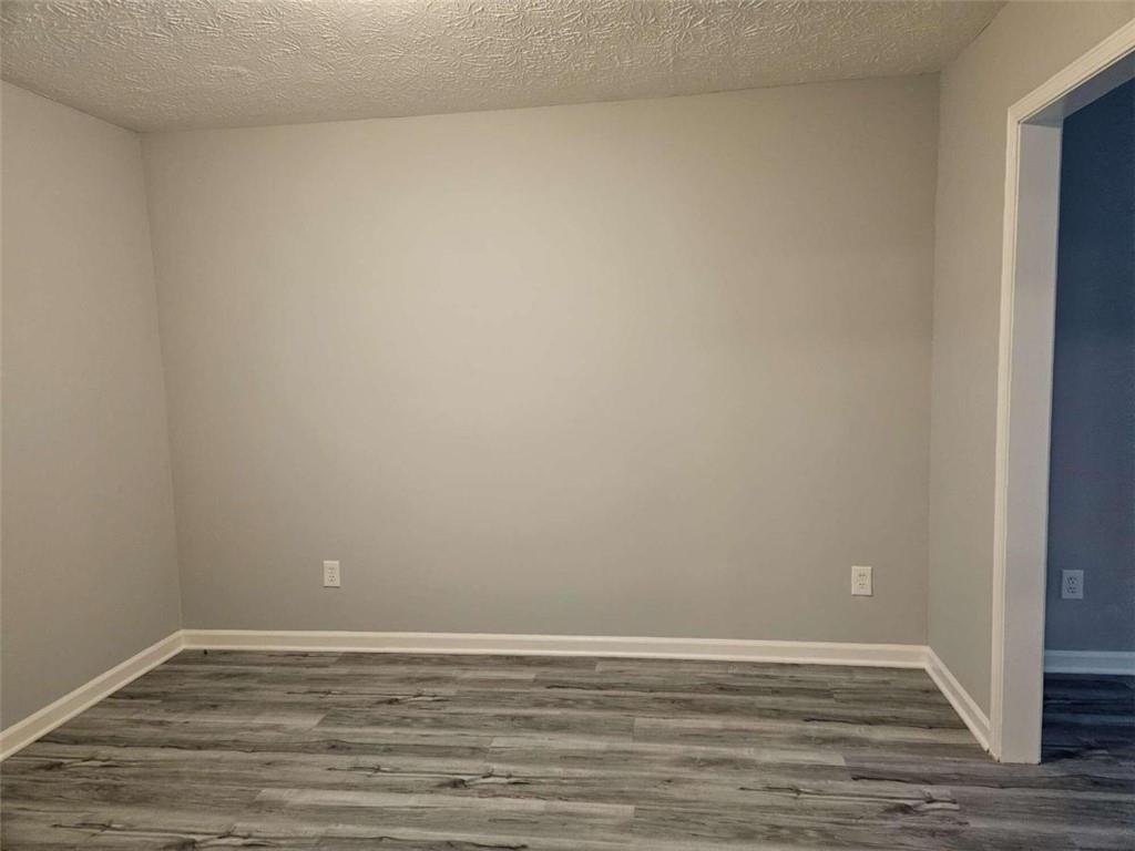 4321 Sebring Walk Decatur, GA 30034 - Photo 9 of 31 a view of an empty room with wooden floor