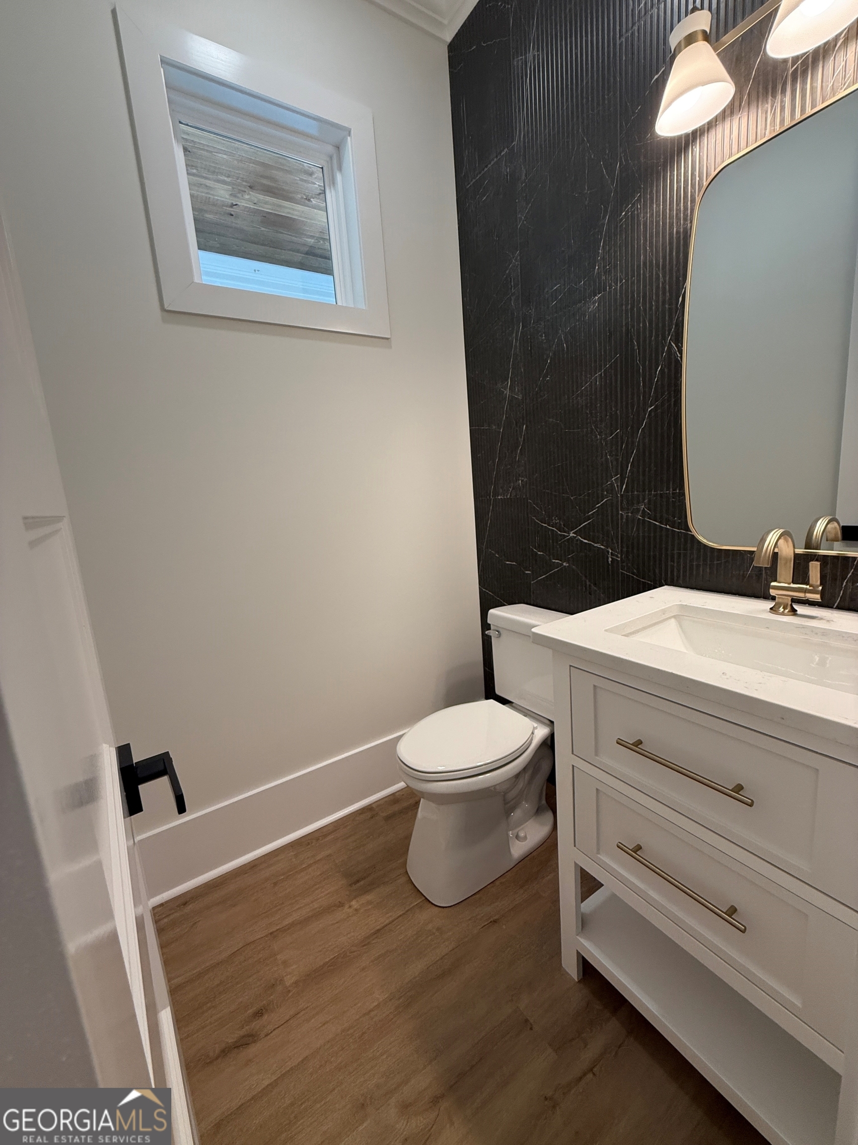 227 Morgan Farm Road Leesburg, GA 31763 - Photo 19 of 33 a bathroom with a toilet sink and mirror