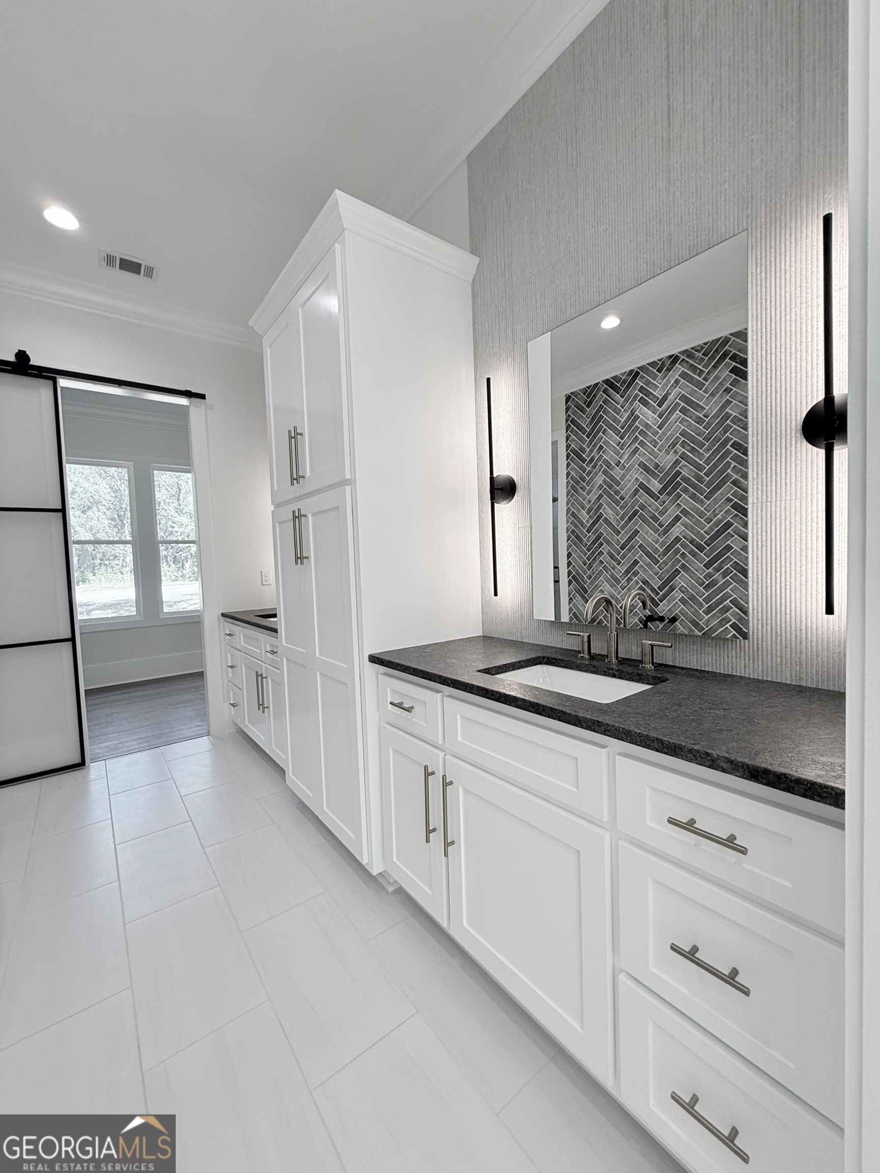 227 Morgan Farm Road Leesburg, GA 31763 - Photo 30 of 33 a bathroom with granite countertop a two sinks a large mirror and a shower