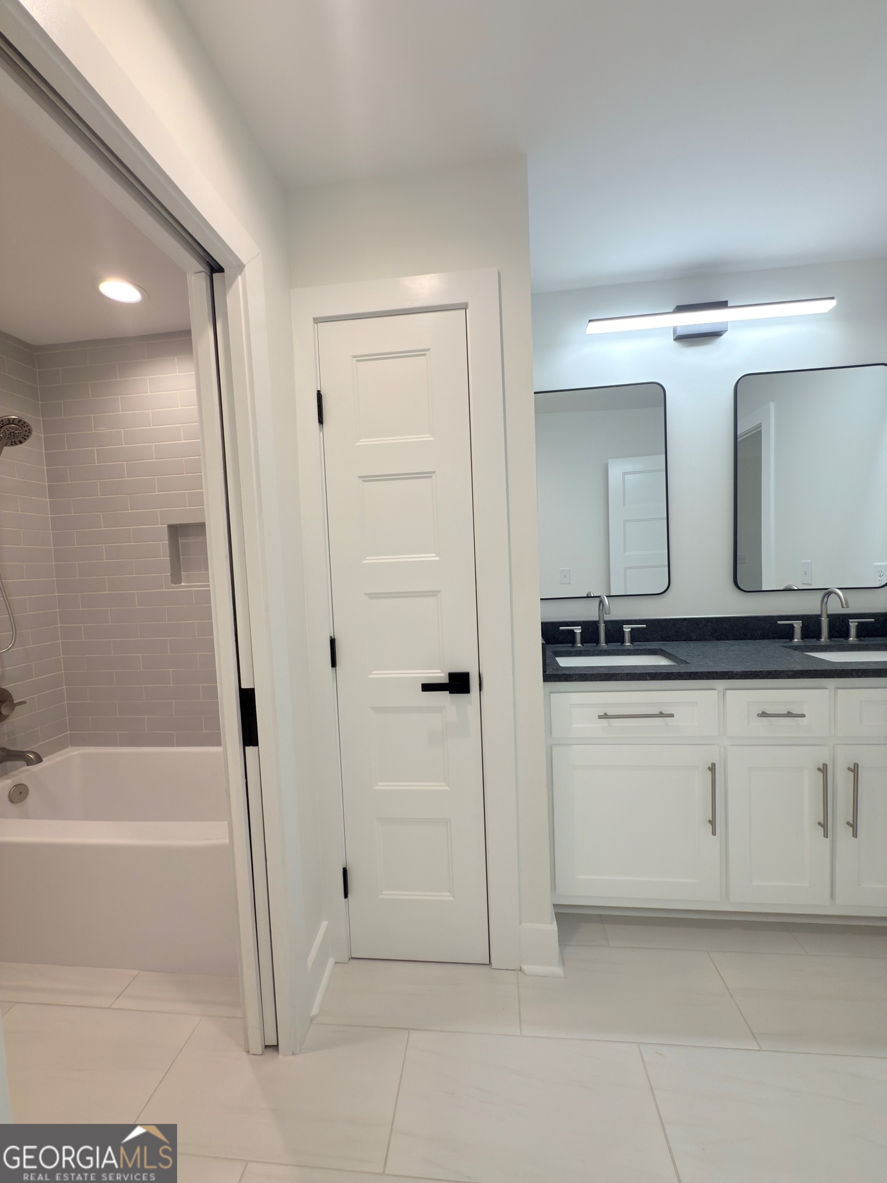 227 Morgan Farm Road Leesburg, GA 31763 - Photo 32 of 33 a bathroom with a double vanity sink and mirror