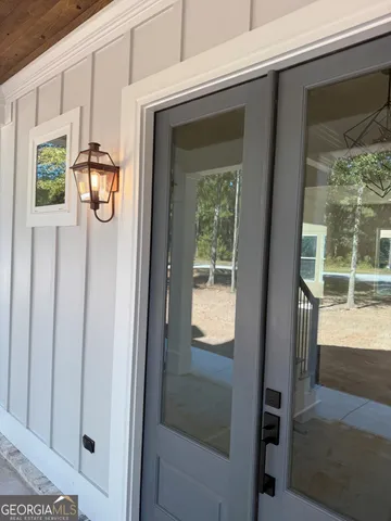 a view of an empty room with windows