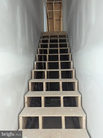 a view of an empty room with stairs