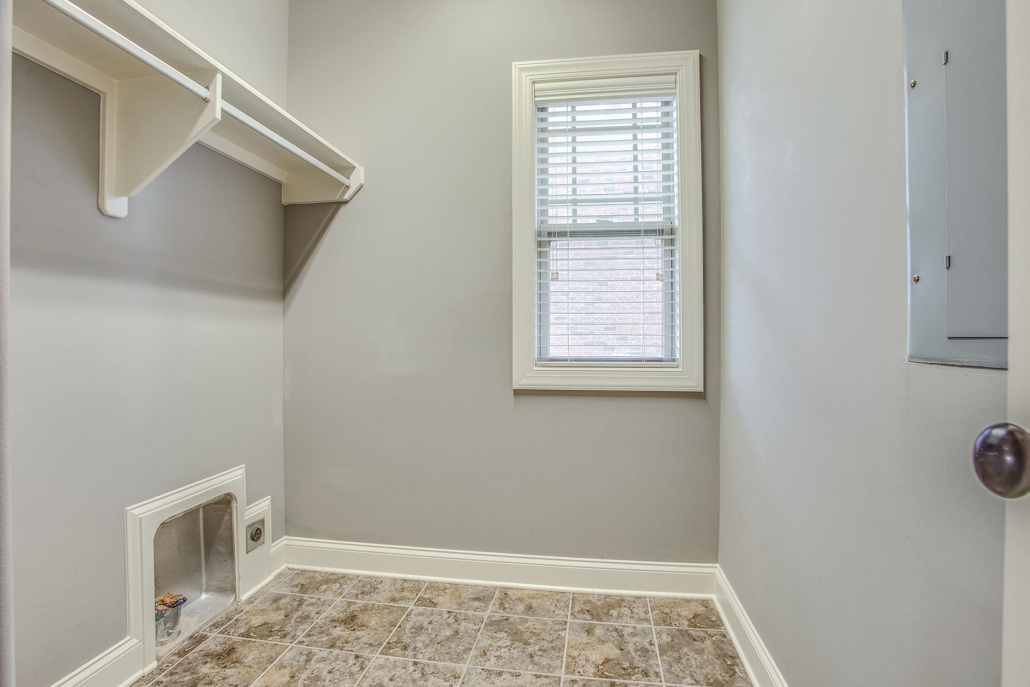 7026 Brindle Ridge Way Spring Hill, TN 37174 - Photo 15 of 23 Laundry room with shelving.