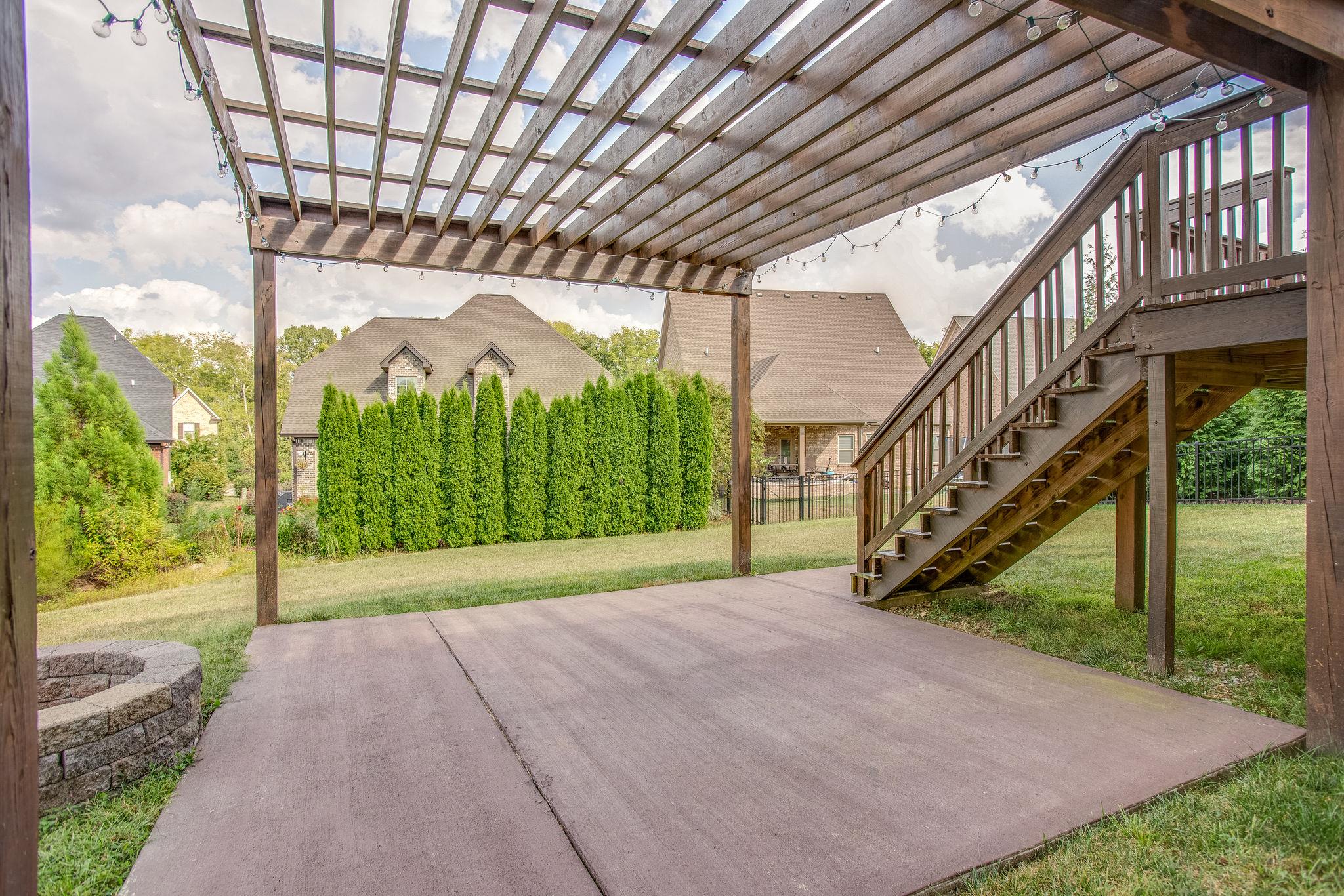 7026 Brindle Ridge Way Spring Hill, TN 37174 - Photo 22 of 23 Extra patio space with bonfire pit. Perfect for s'mores!