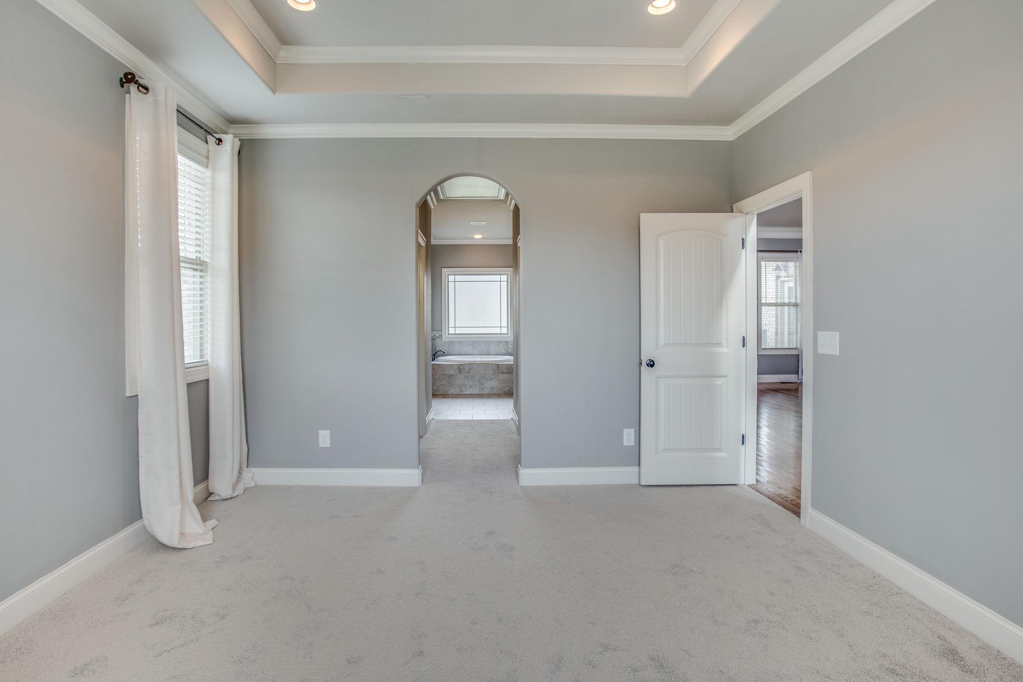 7026 Brindle Ridge Way Spring Hill, TN 37174 - Photo 10 of 23 Master bedroom has separate His/Her walk in closets leading to the bathroom.