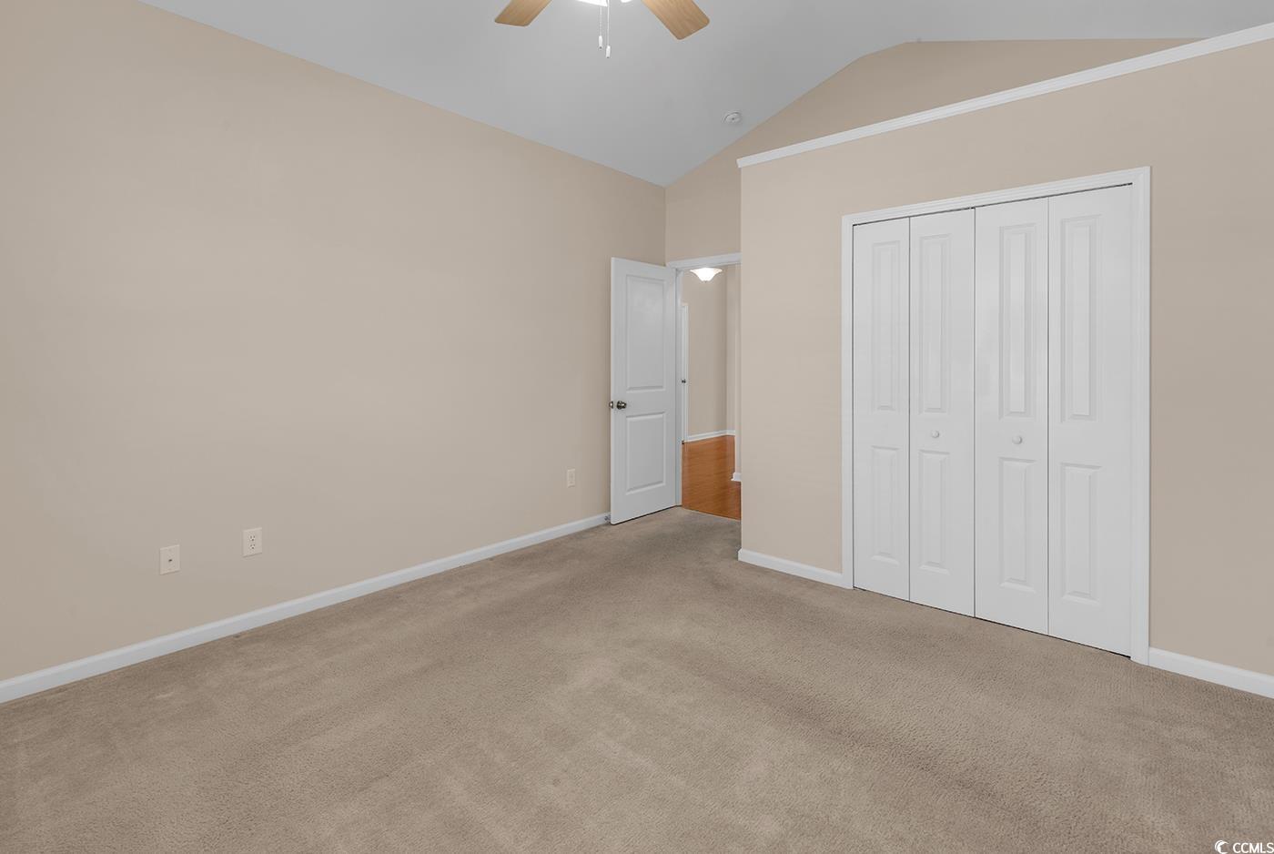 1612 Fairforest Court Conway, SC 29526 - Photo 27 of 40 Unfurnished bedroom featuring vaulted ceiling, carpet flooring, a ceiling fan, and a closet