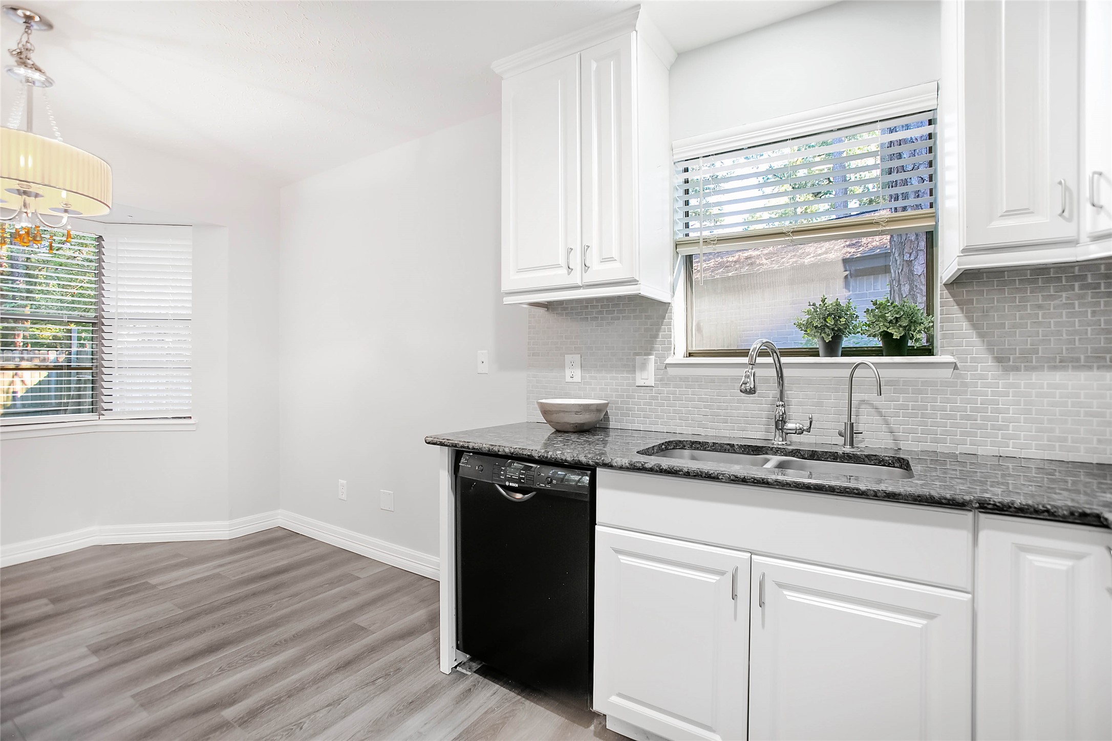 56 East White Willow Circle Spring, TX 77381 - Photo 17 of 45 a kitchen with a sink and cabinets