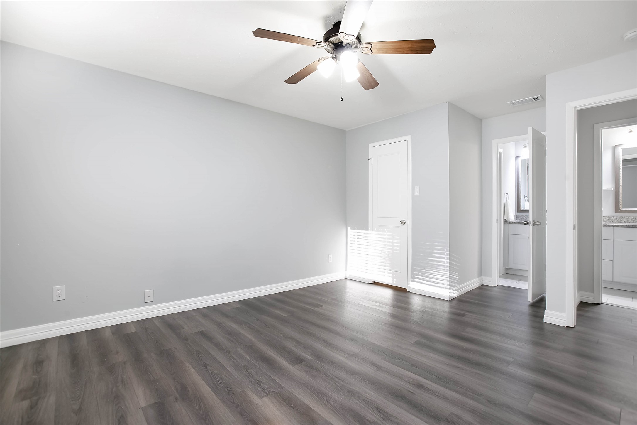 56 East White Willow Circle Spring, TX 77381 - Photo 20 of 45 a view of an empty room with wooden floor