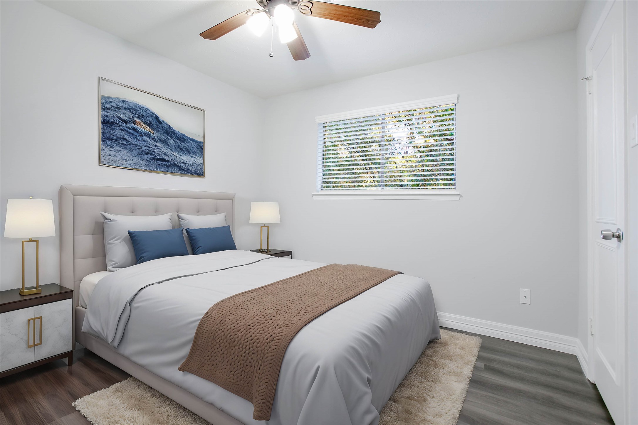 56 East White Willow Circle Spring, TX 77381 - Photo 28 of 45 a bedroom with a large bed and a chandelier