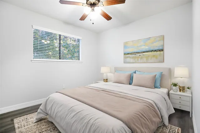 a bedroom with bed and window