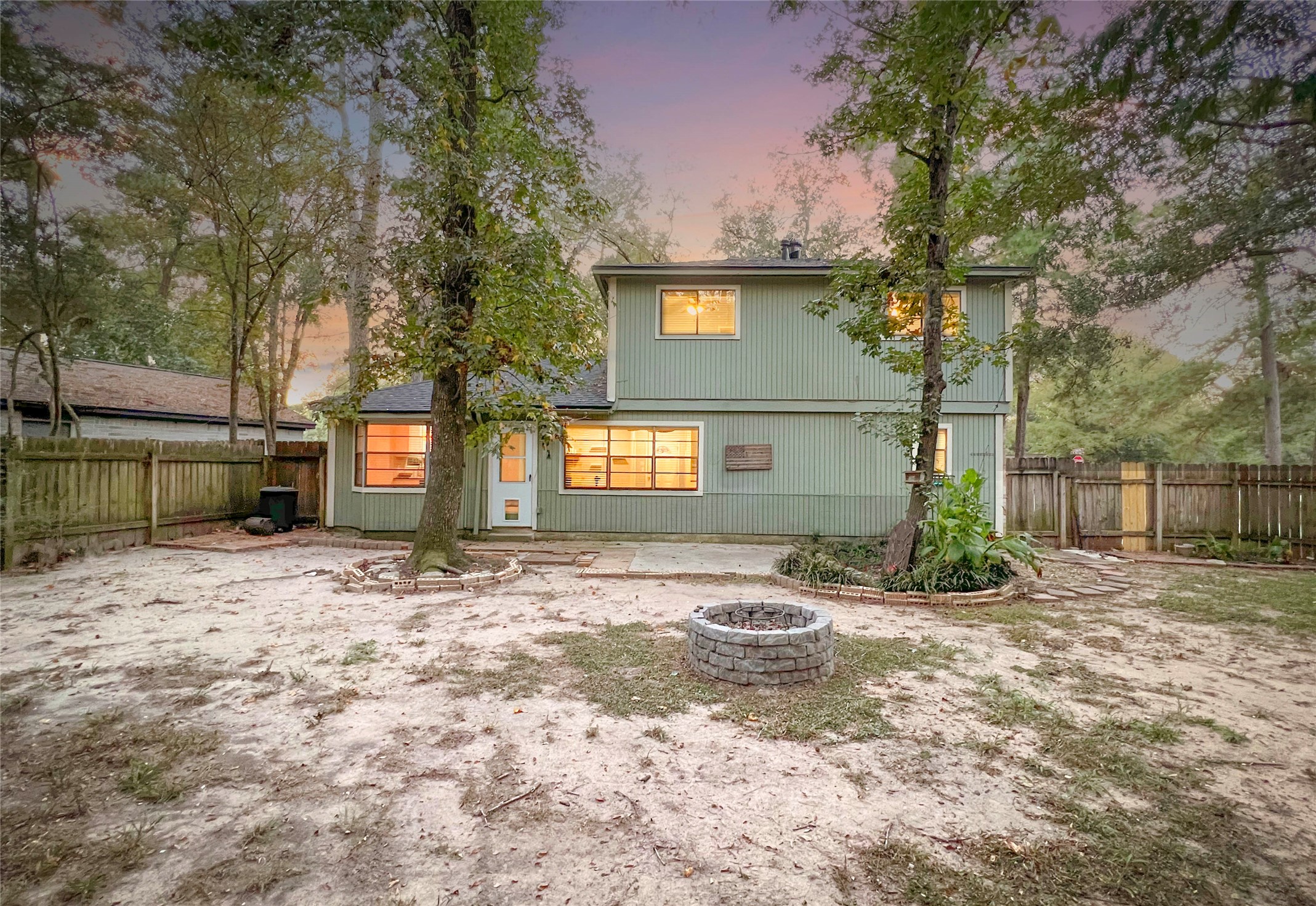 56 East White Willow Circle Spring, TX 77381 - Photo 40 of 45 a view of a backyard with large trees