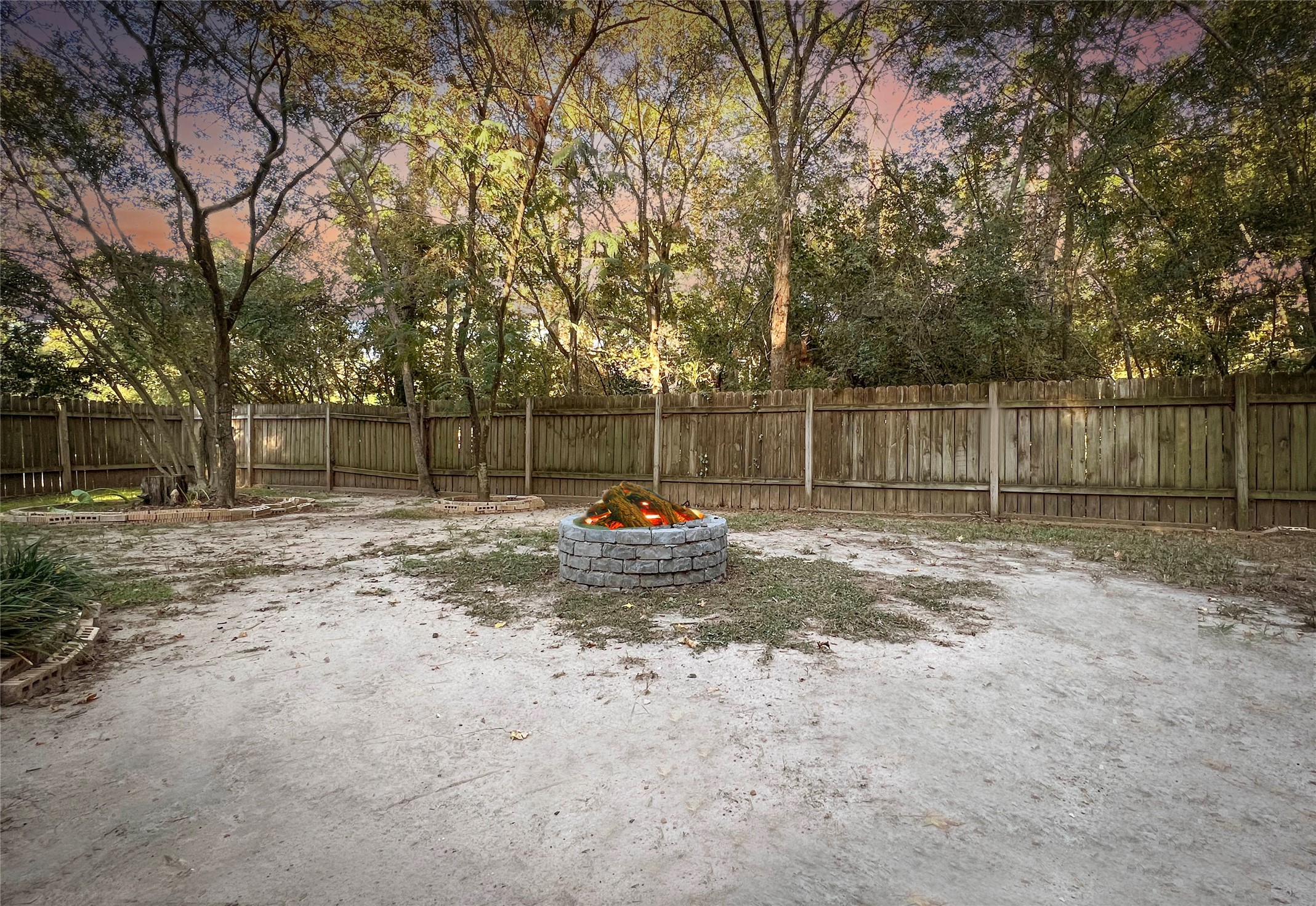 56 East White Willow Circle Spring, TX 77381 - Photo 42 of 45 a view of yard with wooden fence and a trees