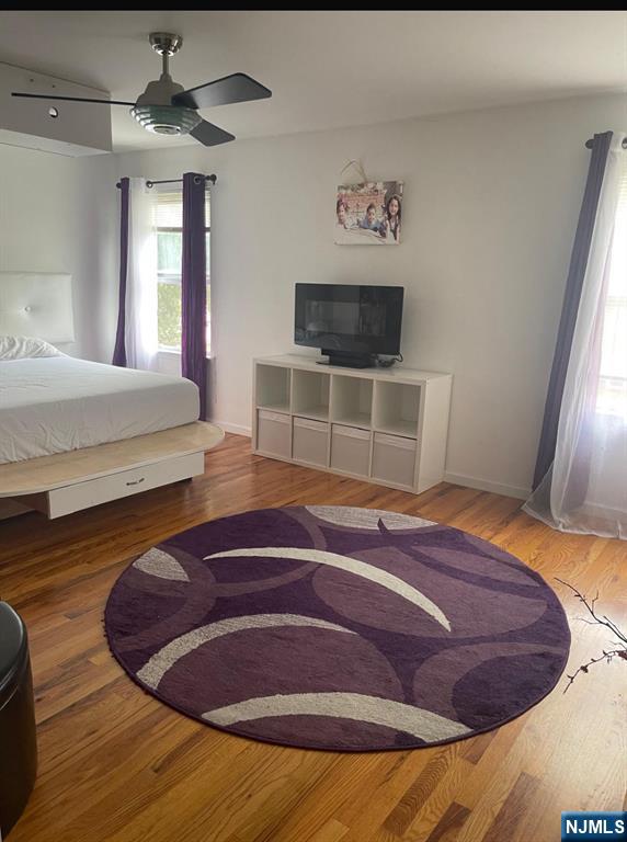 847 Bond Street, Unit 1 Elizabeth, NJ 07201 - Photo 2 of 10 a room with a bed and a television