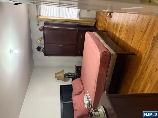 847 Bond Street, Unit 1 Elizabeth, NJ 07201 - Photo 3 of 10 a bedroom with a bed and a window
