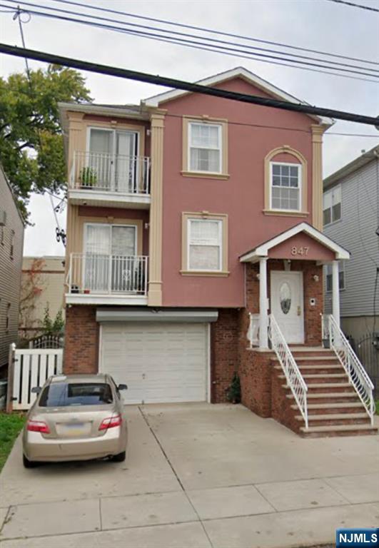 847 Bond Street, Unit 1 Elizabeth, NJ 07201 - Photo 7 of 10 a front view of a house with parking space